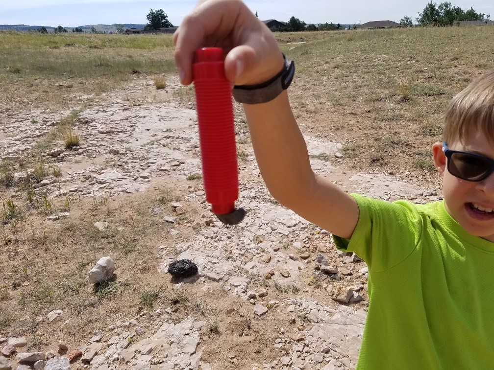 Student showing off findings during the tacos summer camp.
