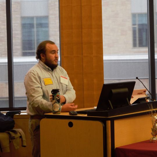 Fox Nelson, a first-generation graduate student and former McNair Scholar, presenting at the 2023 National First-Generation College Student Celebration Day. 