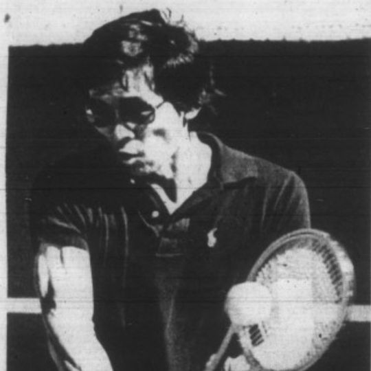Aged photo of Dr. Fuji Adachi playing tennis. 