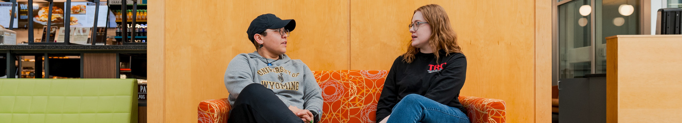 TRIO SSS advisor and student having a conversation together in the ENZI STEM building at UW.