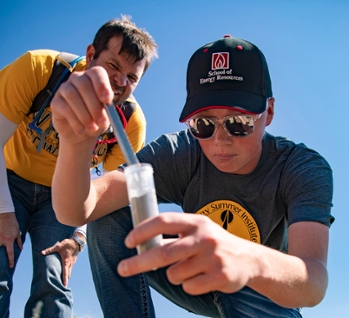 Student and faculty conducting a soil test at Curt Gowdy State Park at University of Wyoming