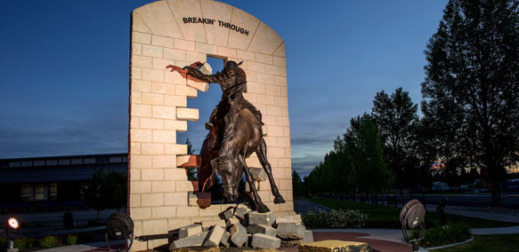 breaking through statue at nighttime
