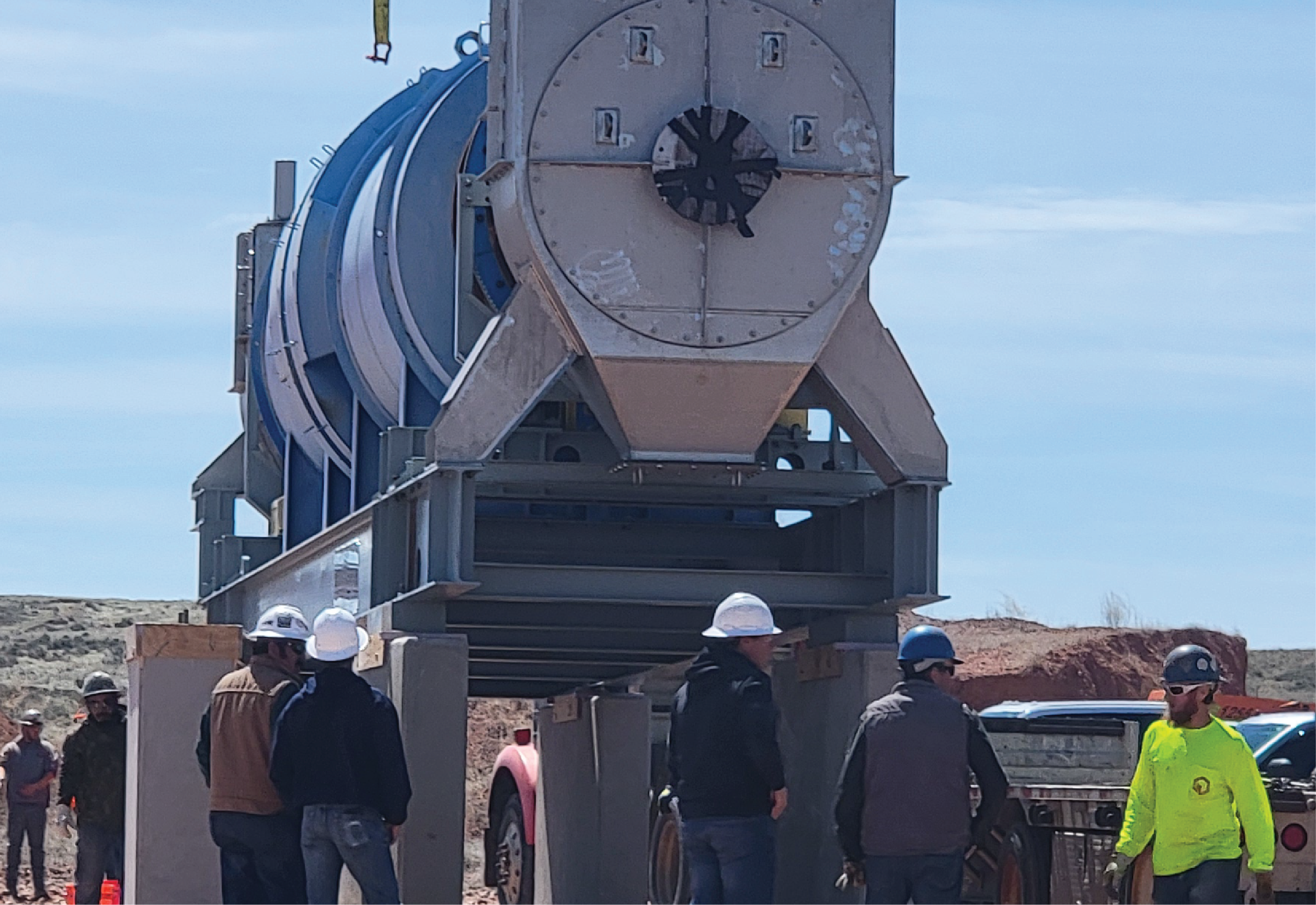 calciner unite being installed with workers overseeing the area