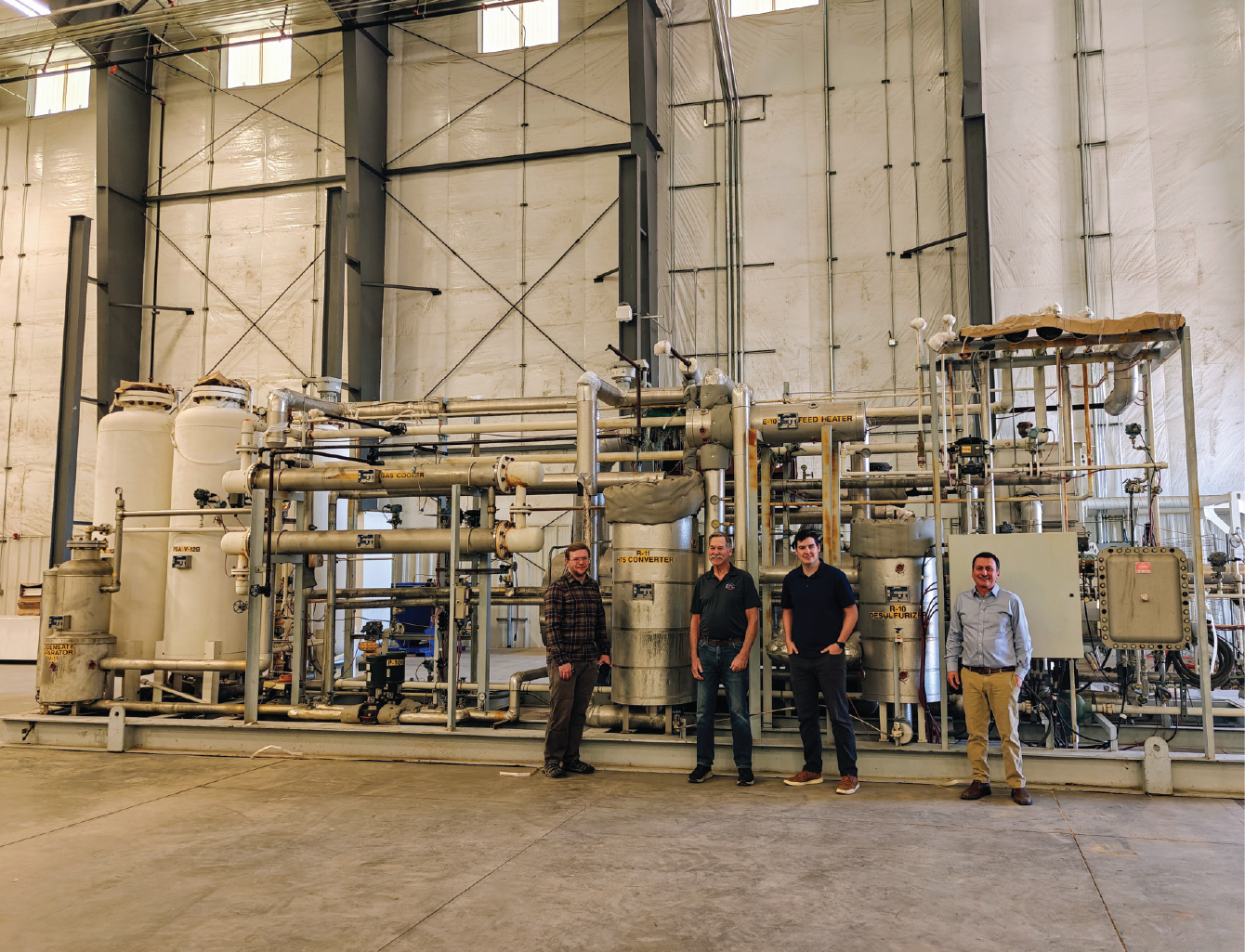 Group of people in front of a Steam Methane Reform unit