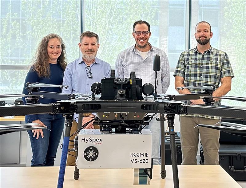 team in behind drone