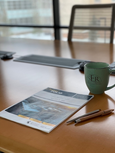 coffee mug and papers on desk