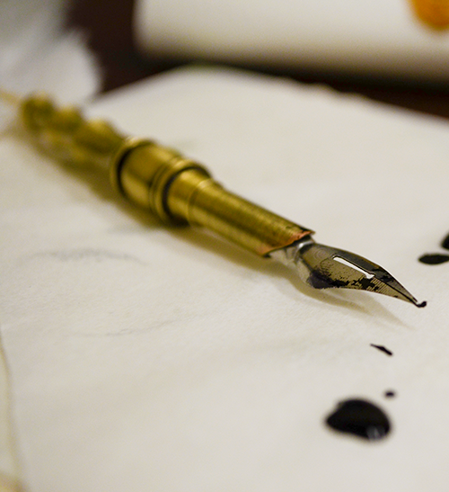 Quill pen and ink blot