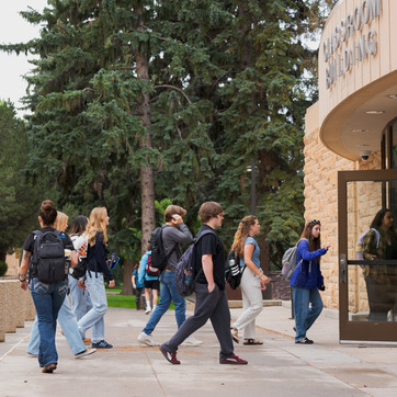 Students walking into the Classroom Building.