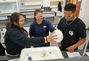 Students working on a chemistry project at the Enzi STEM building while at a UW summer camp.