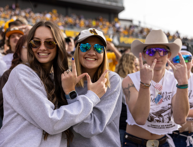 Students celebrate in War Memorial Stadium.
