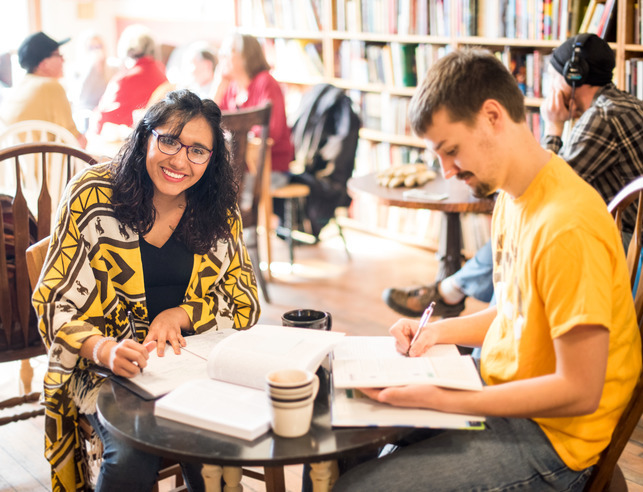 Two students sit studying at Night Heron Books in downtown Laramie.