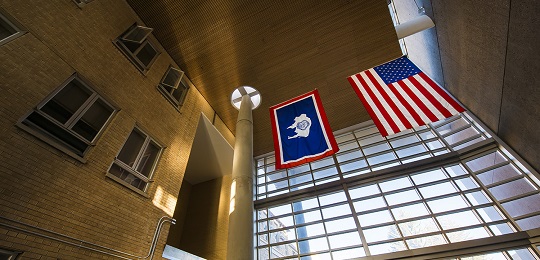 Wyoming state flag and American flag hanging in the Berry Biodiversity Conservation Center