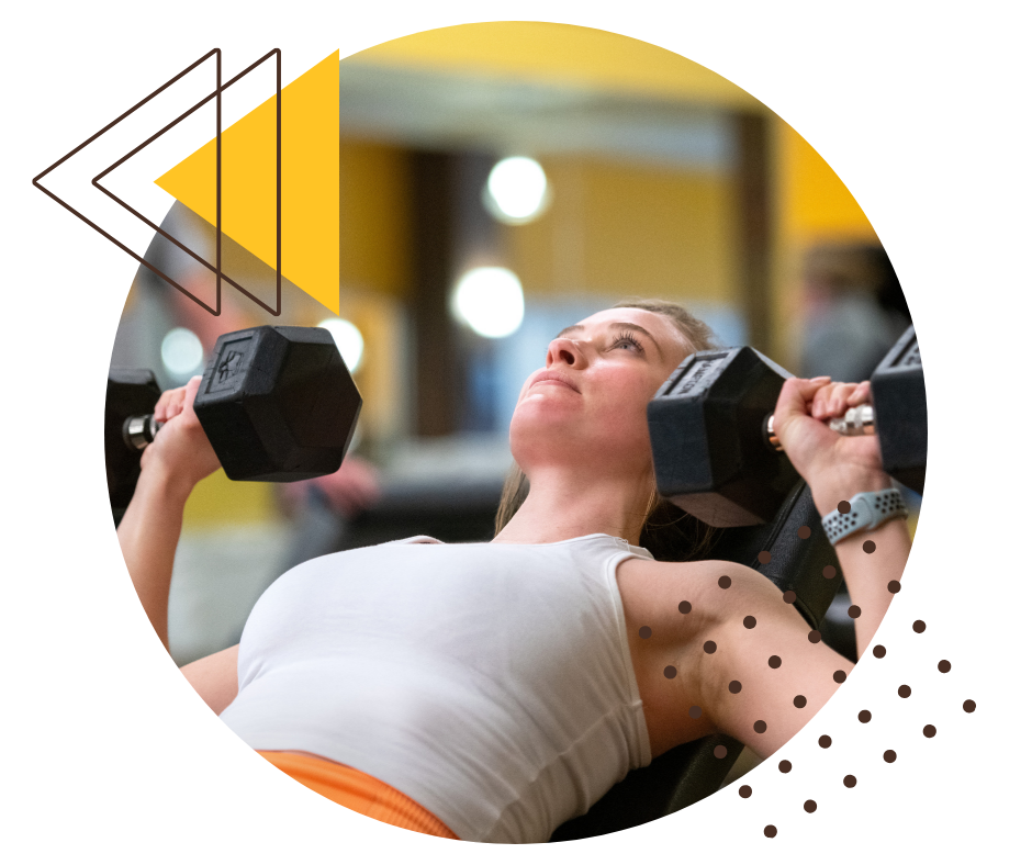 woman benching weights in the gym.