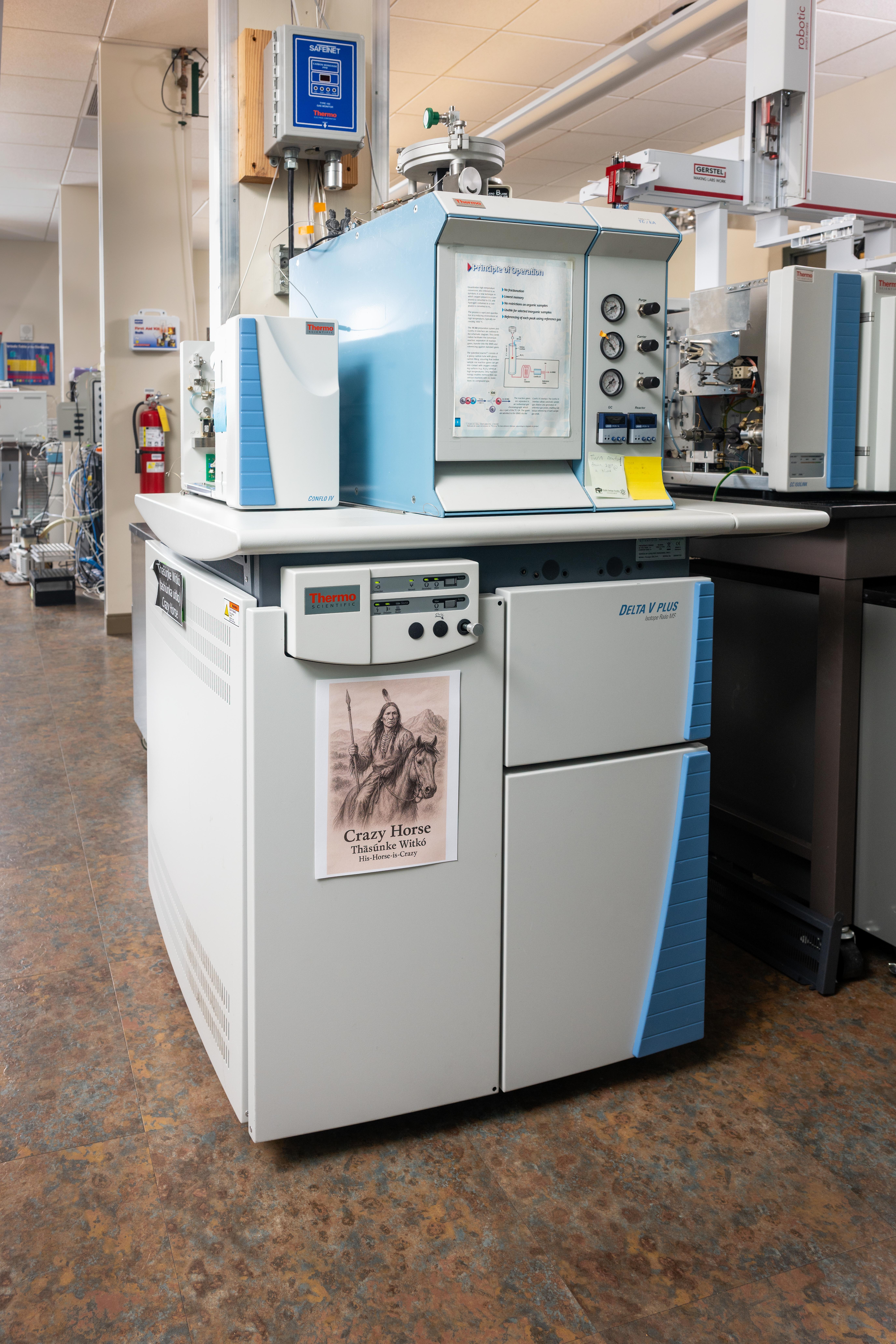 A Thermal Conversion Mass Spectrometer, a blue steel case with an autosampler on top. 