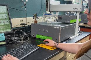 A Picarro cavity ringer down spectrometer, a grey and green box with a water injection autosampler on top. 