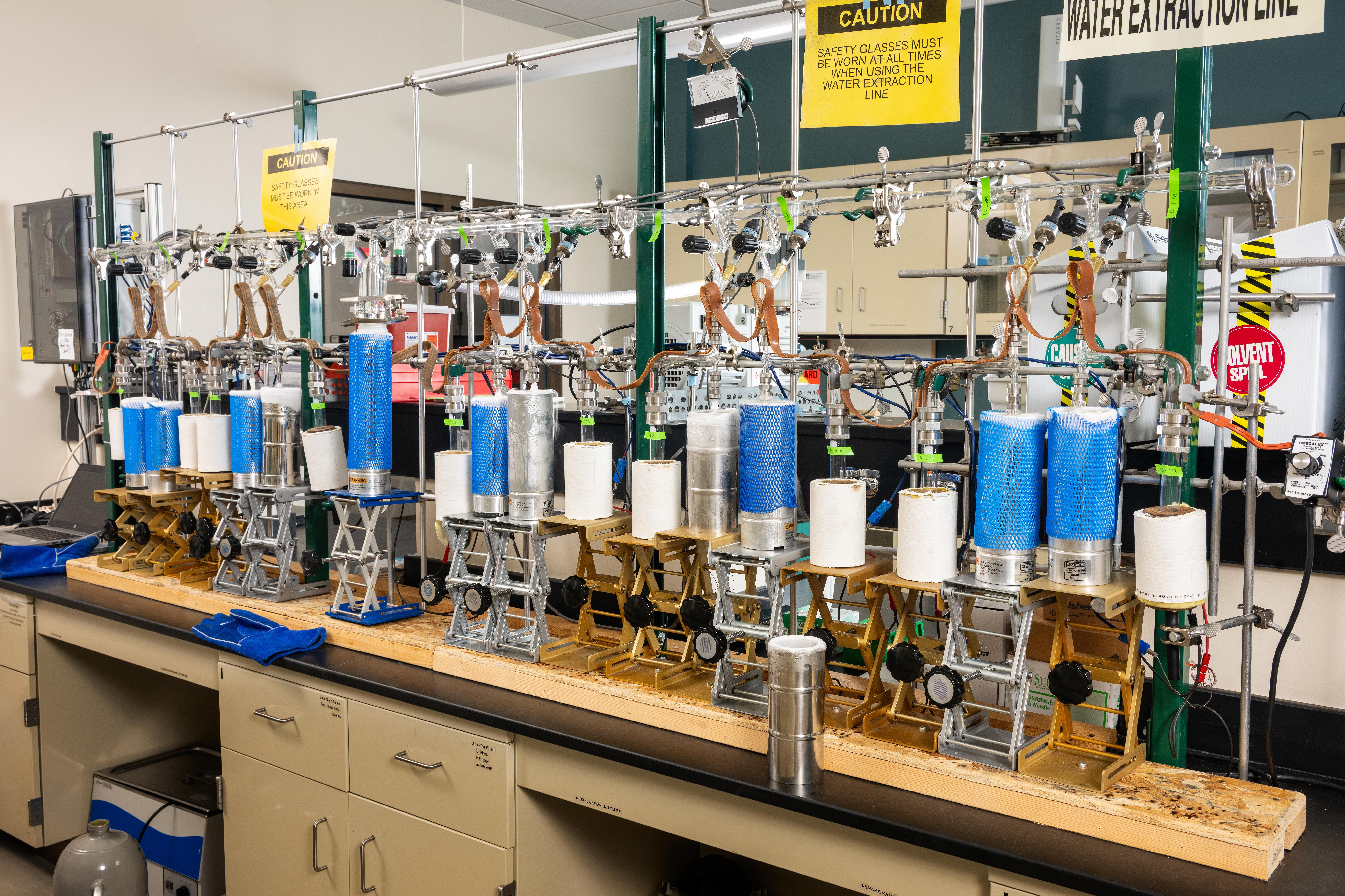 A stylized atom with the earth as the nucleus.