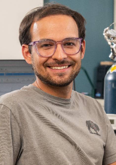 A young man, named Callum Russel, smiling.