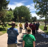 Group of MSC students walking through the sunny University of Wyoming campus in Laramie