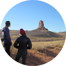 Students looking at distant 3 Sisters rock formation