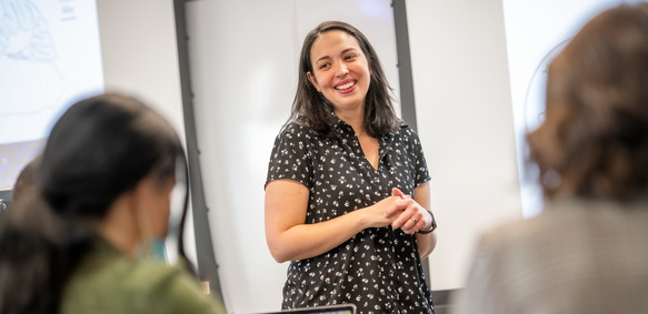 A teacher smiles at their class during a lesson at the University of Wyoming.