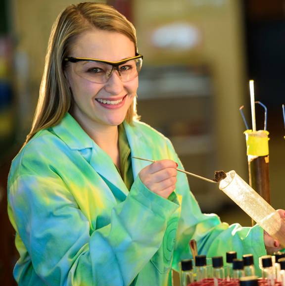 student using a beaker
