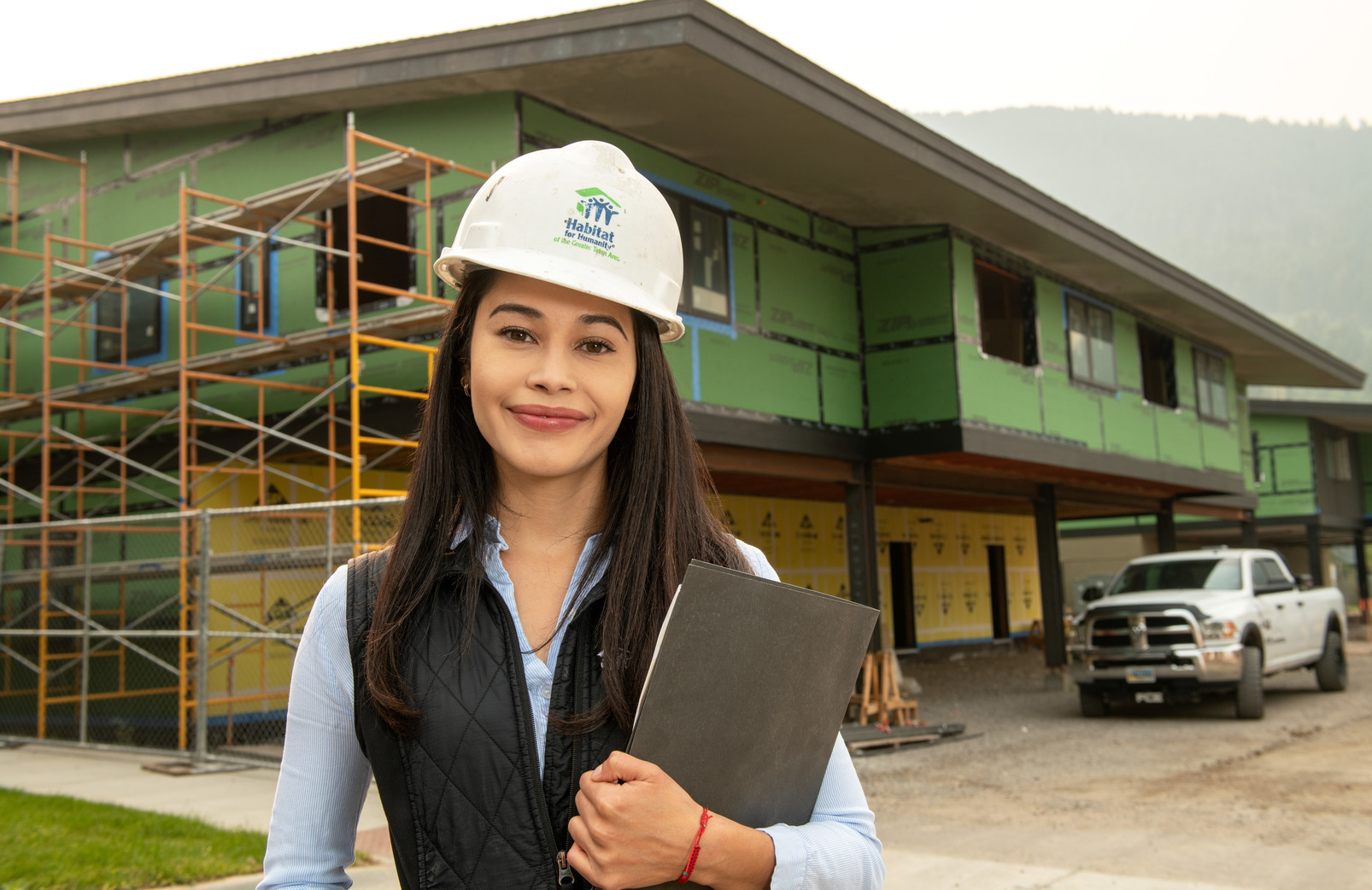 A UW alumni on an construction job site for Habitat for Humanity