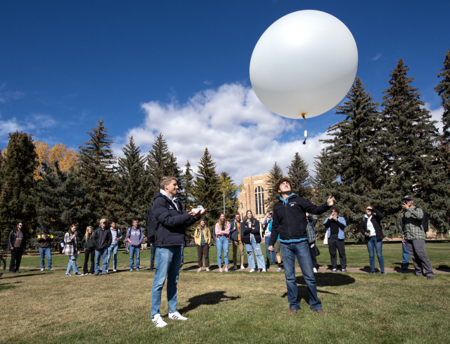 Students preparing a weather ballon.