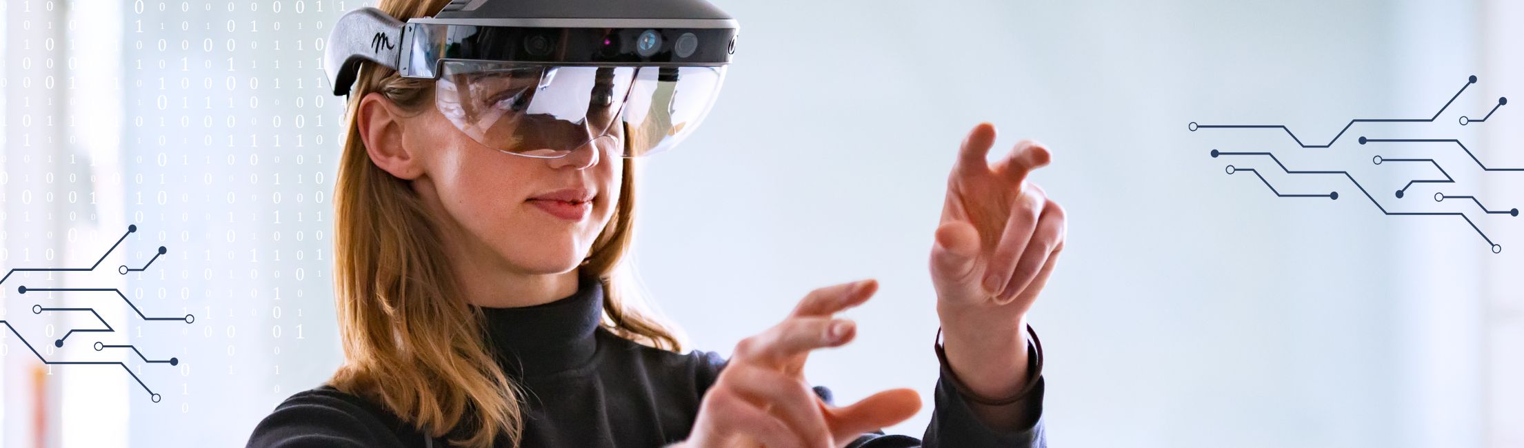 UW Student with virtual reality glasses on hold their hands up