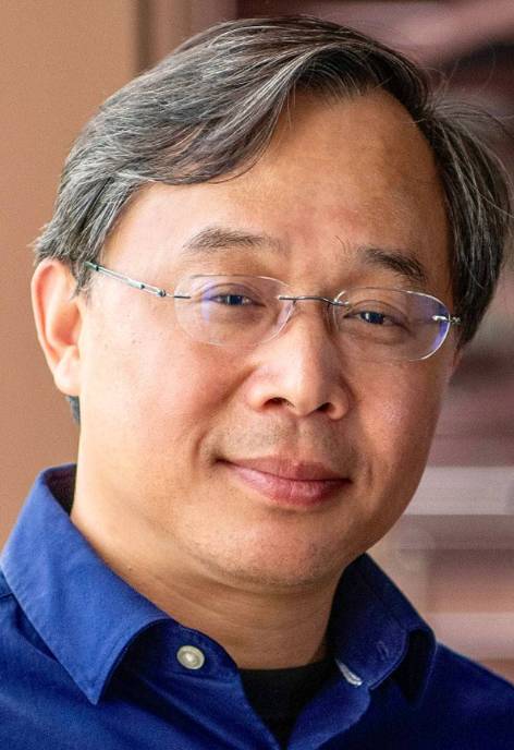 Dr. Junhua Ding, Dean School of Computing wearing a blue shirt