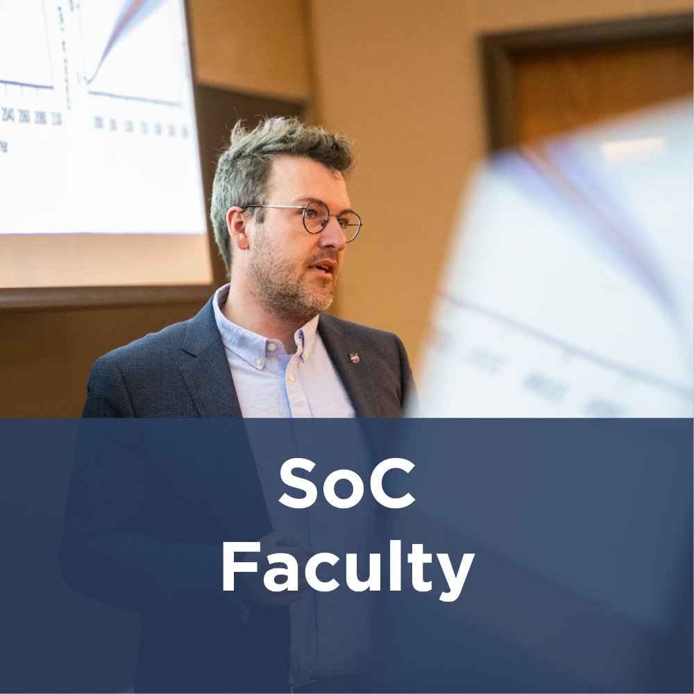 SoC Faculty icon - man standing in front of class lecturing
