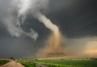 A tornado in a agricultural field.