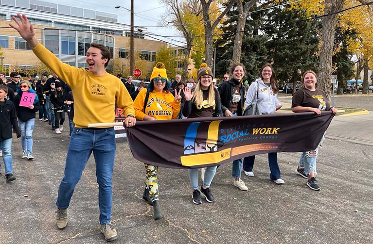 Students marching in a parade. 