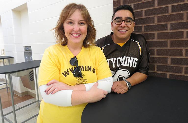 A woman and a man attending a college social event
