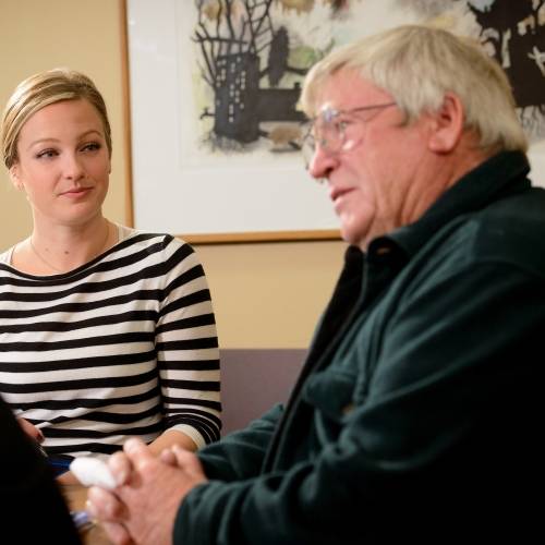 A young woman and an old man.
