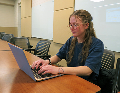 A female student using a laptop computer. 