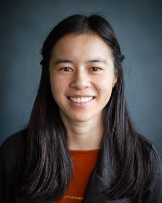 Girl with black hair smiling