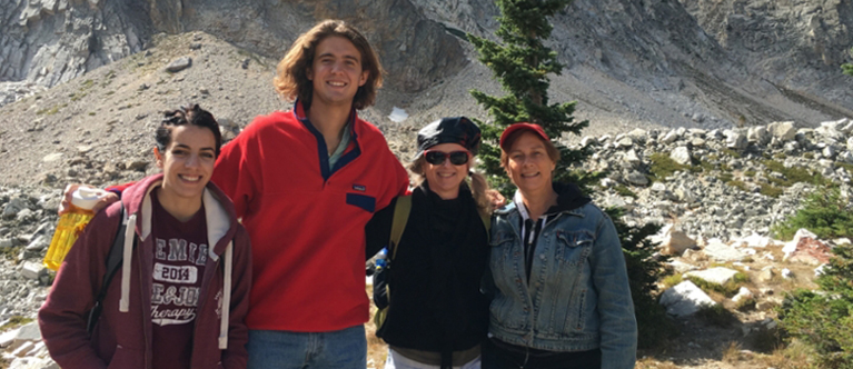 Students standing in front of a mountain