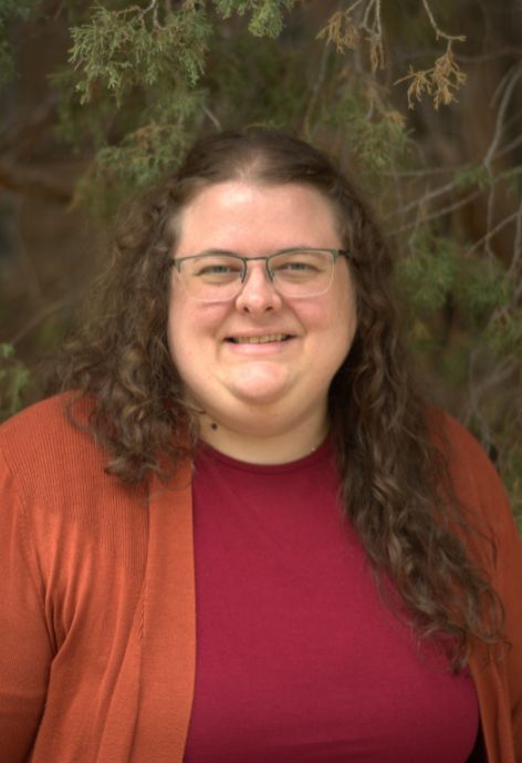 Dr. Michelle Allgood standing in front of a tree