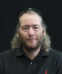 photograph of Dr. Andrew Garner in front of a black background