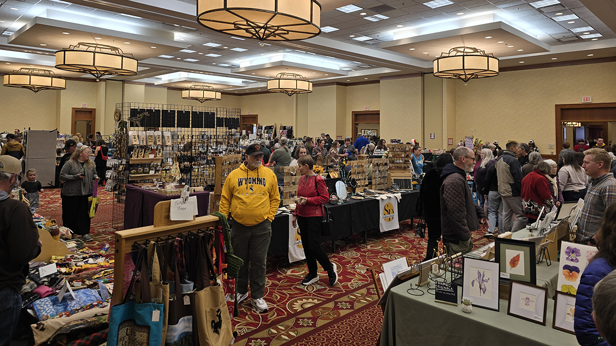 a huge crowd at the staff senate holiday market wandering amongst the many community artisans
