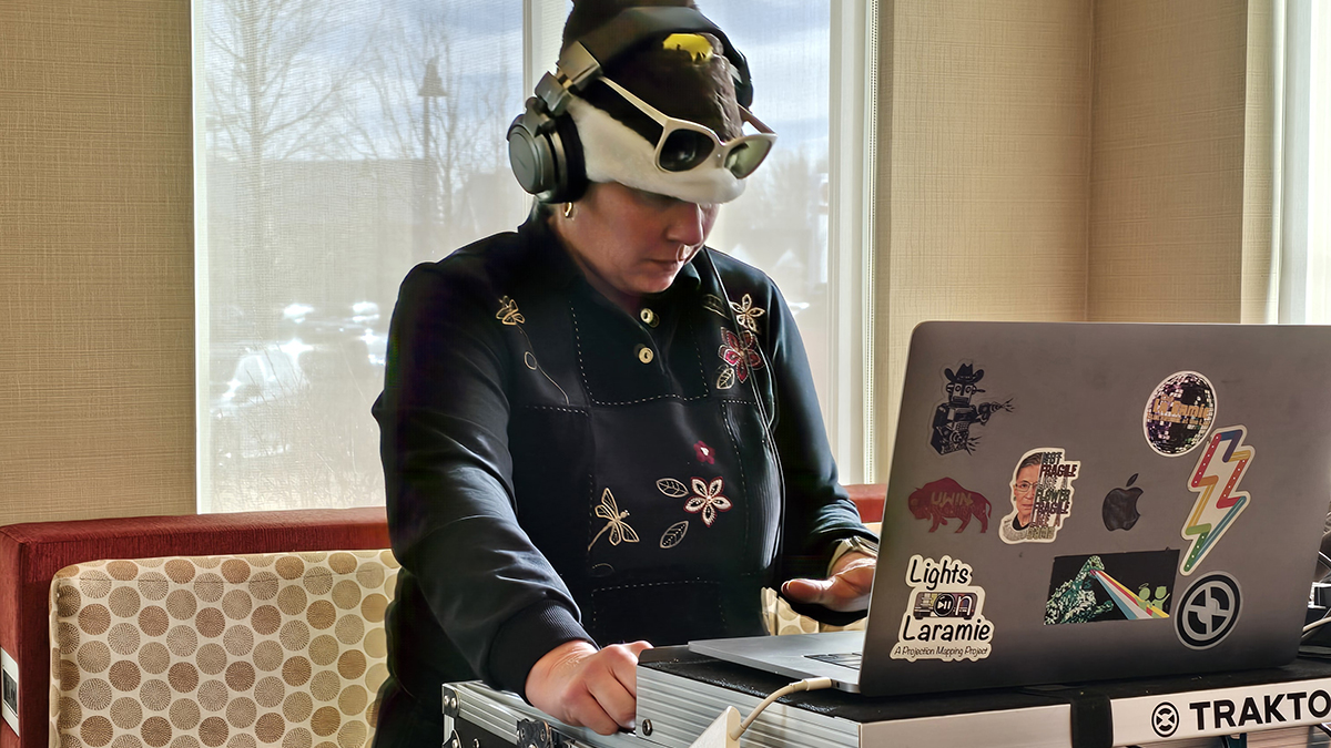 a DJ spinning some festive tunes at the Staff Senate Holiday Market