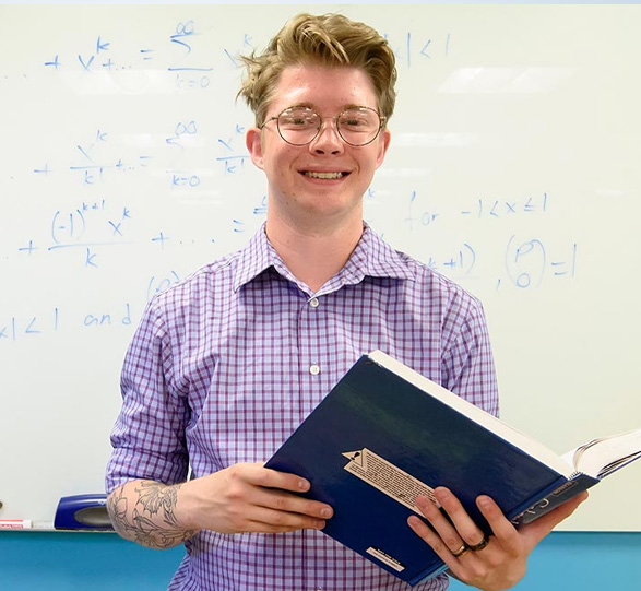 GA standing in front of white board