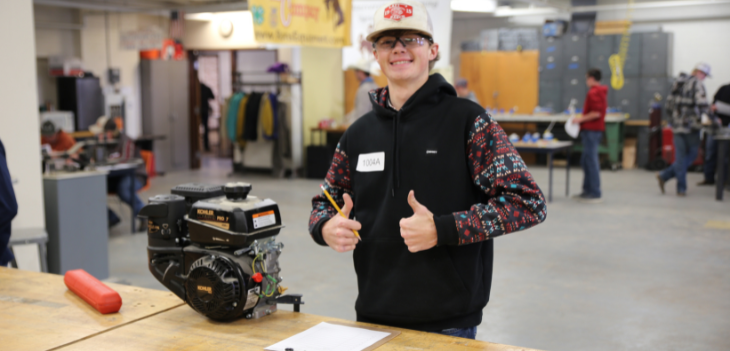 Student giving thumbs up in ag lab