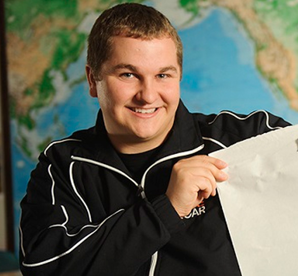 A student holds a piece of paper.