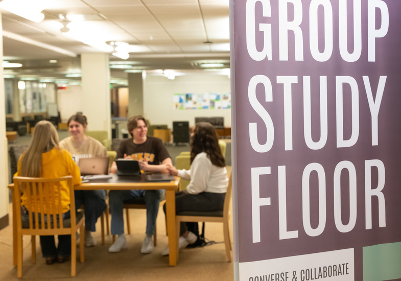 A group of UW students studies together at Coe Library.