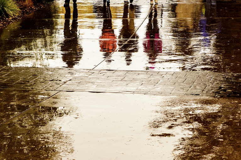 student reflections in the rain