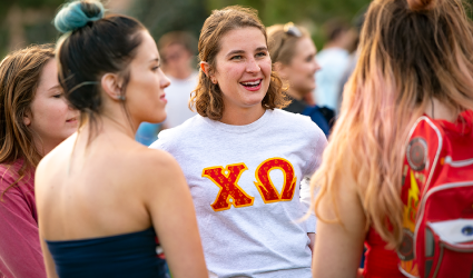 Sorority sisters standing and talking on Prexy's