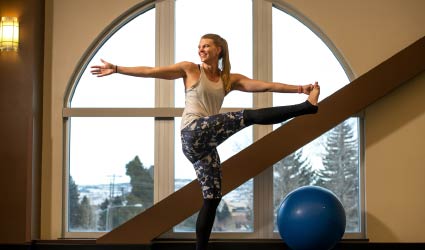 Student doing yoga at Half Acre