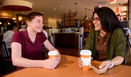 Students in cafe laughing