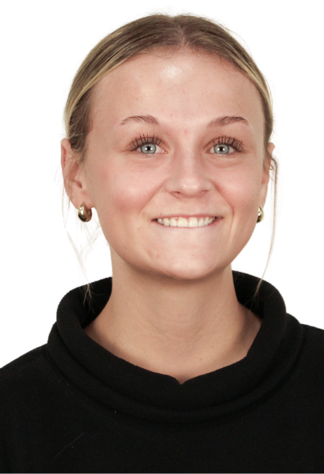 Cowboy Coach Kayla Remiger poses for a photo